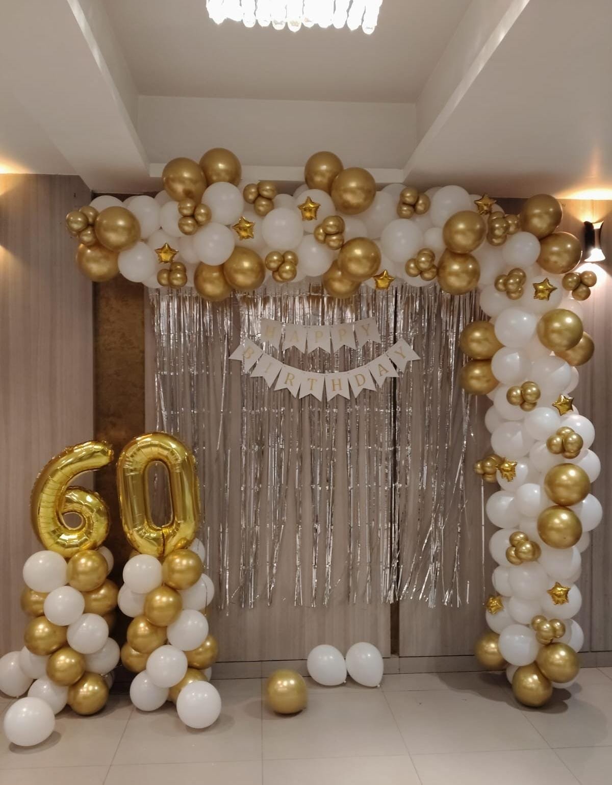 Gold and white balloon arch